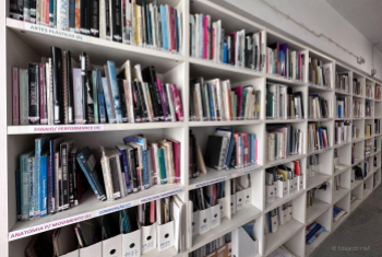 Image of a library shelf. by Eduardo Hall